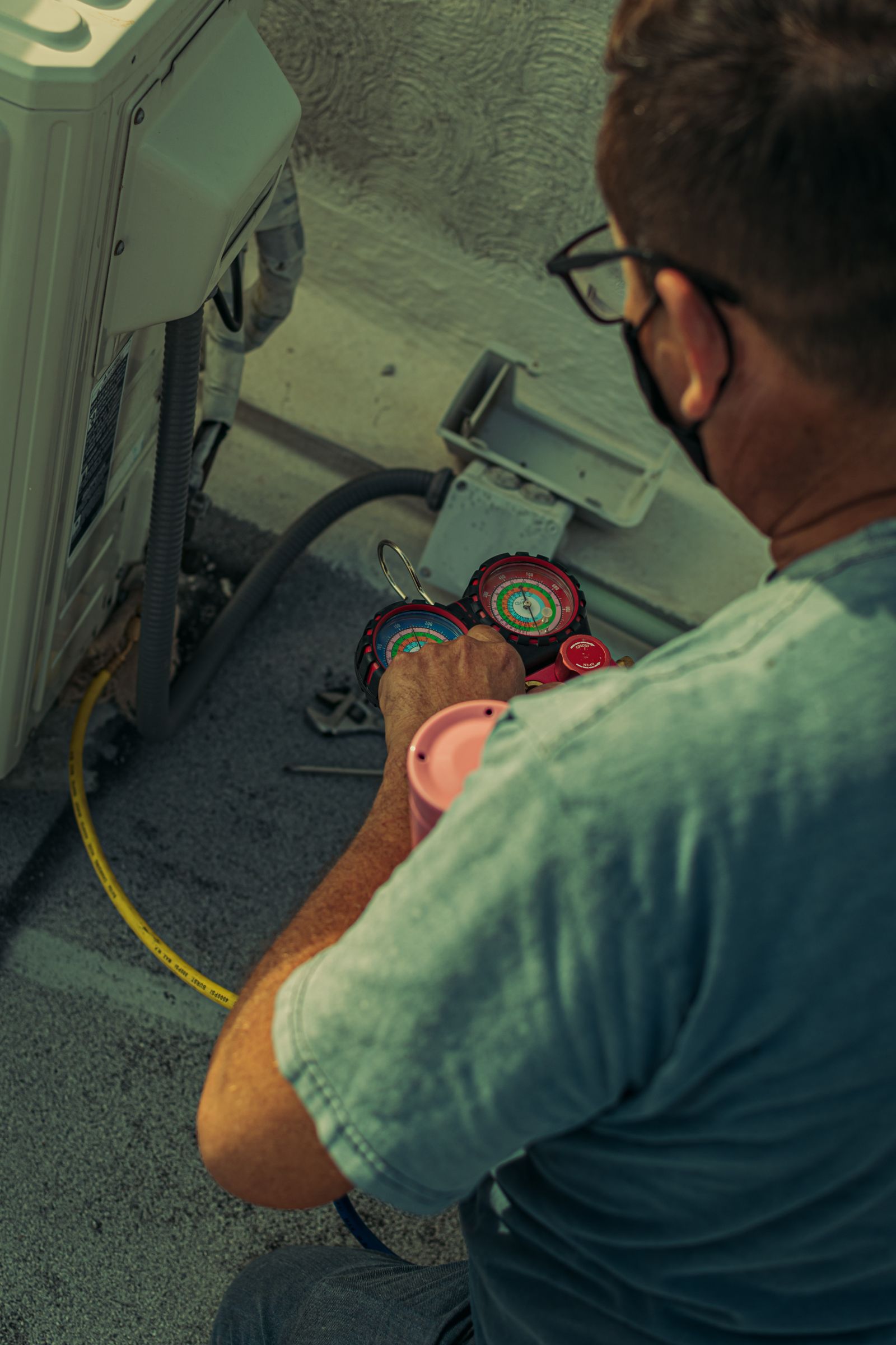 HVAC technician working on a rooftop unit